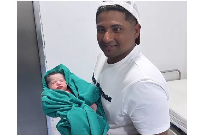 Sarfaraz Khan is all smiles as he poses with his new born son, in Mumbai, on Tuesday