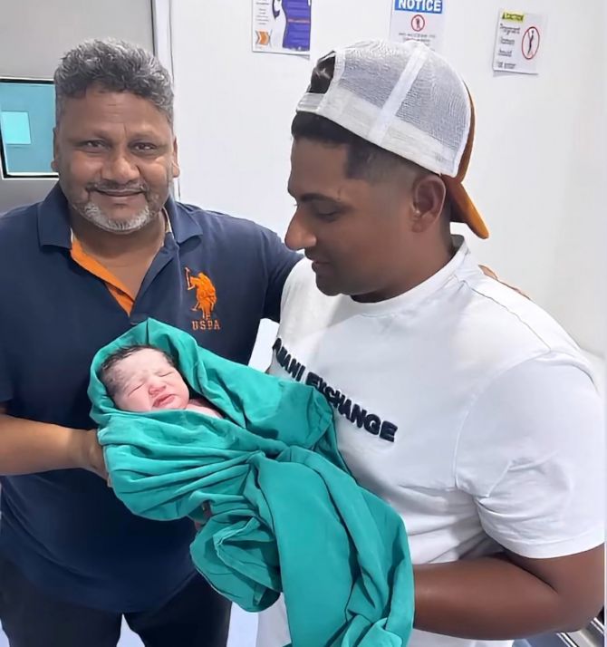 Naushad Khan with son Sarfaraz and the latest addition to their family