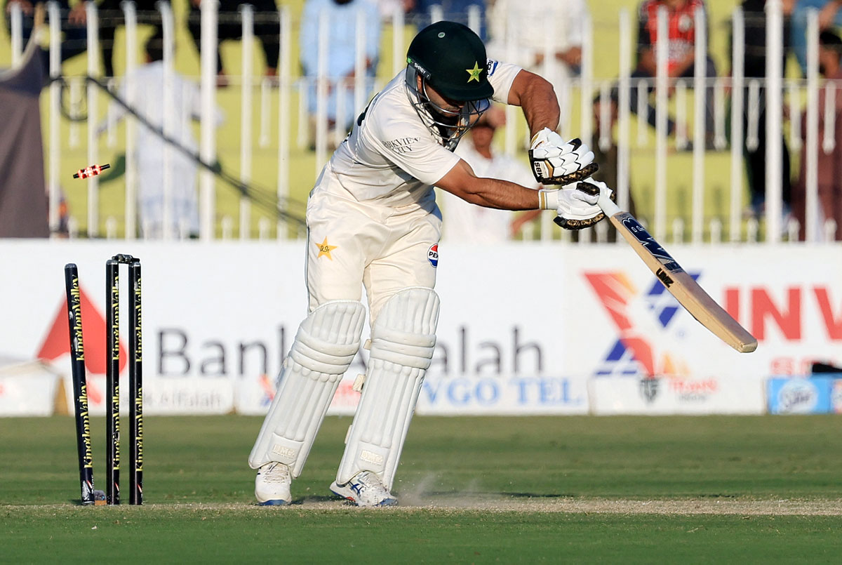 Kamran Ghulam is bowled by Gus Atkinson