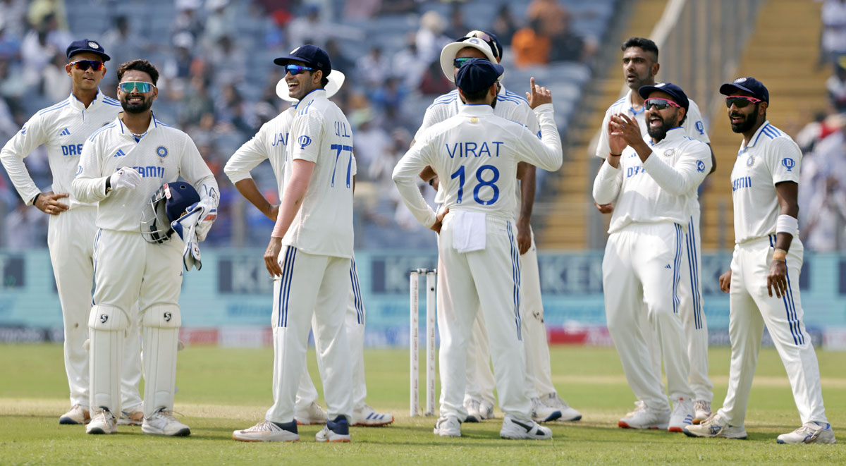 India's players celebrate a wicket