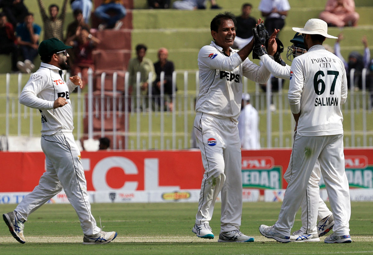 Pakistan's Noman Ali celebrates with teammates