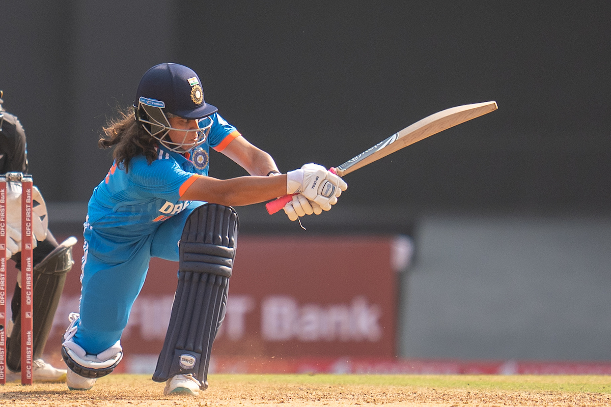 Tejal Hasabnis sweeps the ball to the boundary while scoring 42 off 64 balls.