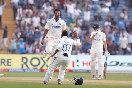 Washington Sundar celebrates the wicket of Tim Southee for his maiden Test five-wicket haul