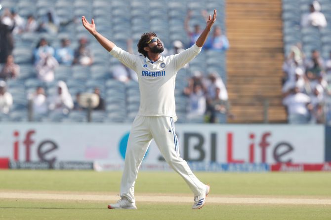 Ravindra Jadeja of india celebrates the wicket of Tom Blundell 