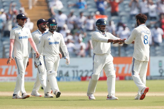 Ravindra Jadeja of india celebrates the wicket of Mitchell Santner