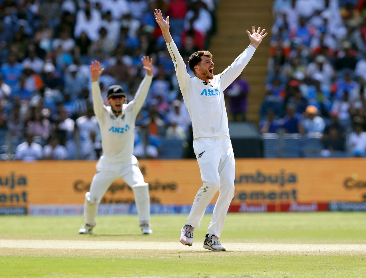 Mitchell Santner celebrates the wicket of Virat Kohli