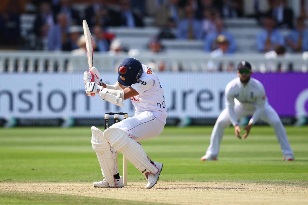  Sri Lanka's Dinesh Chandimal is hit by a bouncer 