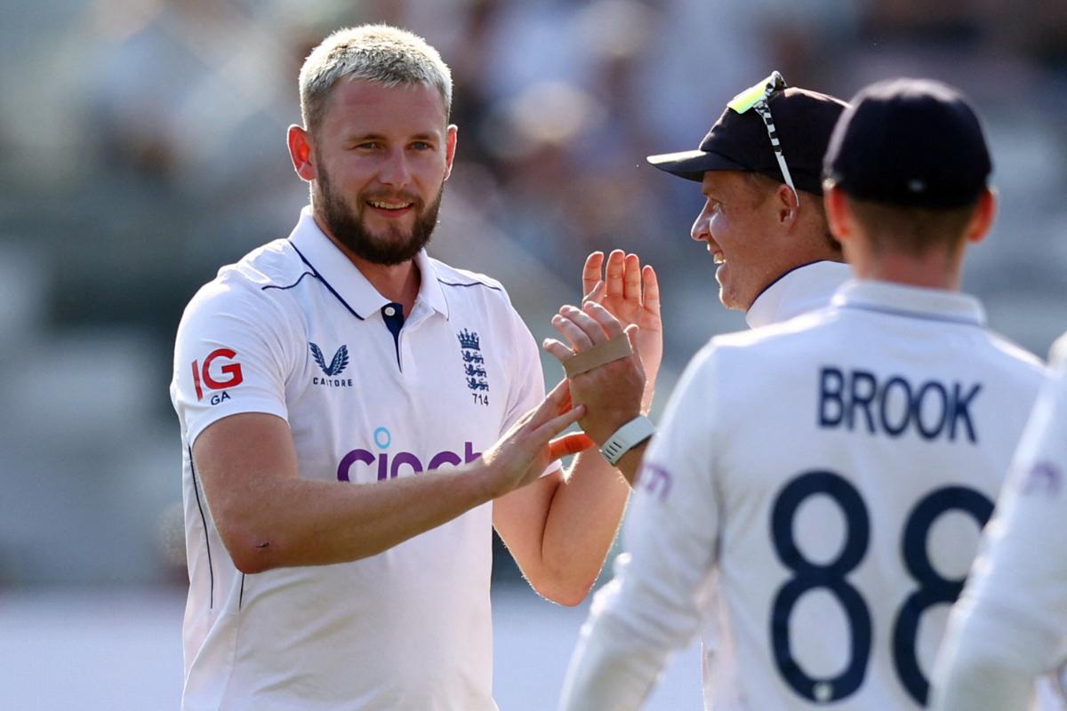 England's Gus Atkinson celebrates with Ollie Pope after taking the wicket of Sri Lanka's Dhananjaya de Silva