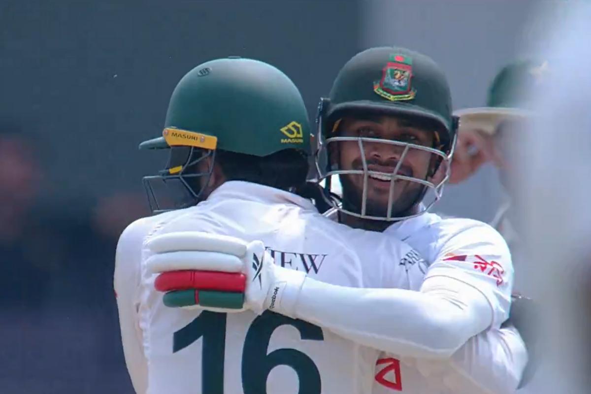 Pakistan's Mohammad Rizwan and Mehidy Hasan hug during play on Day 3 of the 2nd Test in Rawalpindi on Sunday