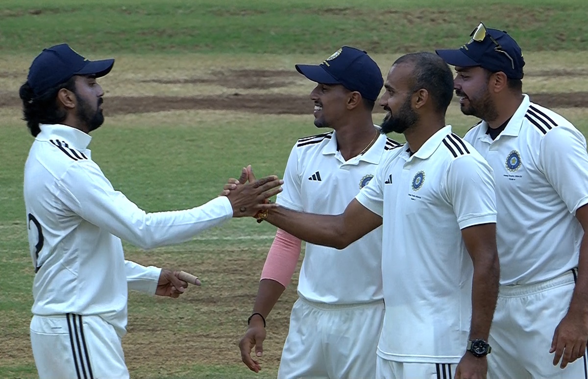 Akash Deep celebrates a wicket with team-mates.