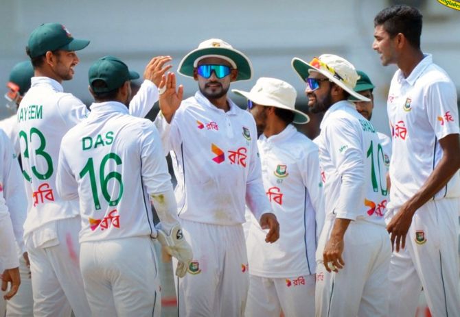 Bangladesh's players celebrate a wicket