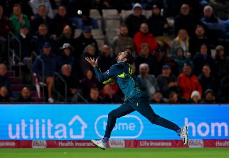 Tim David takes the catch to dismiss Jordan Cox.