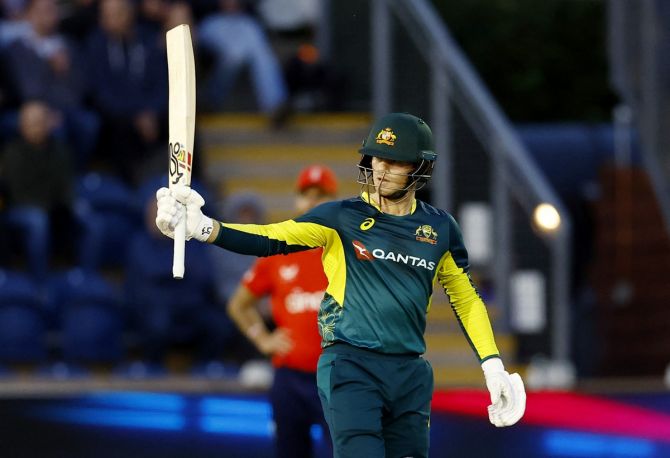 Australia's Jake Fraser-McGurk celebrates completing his half century.