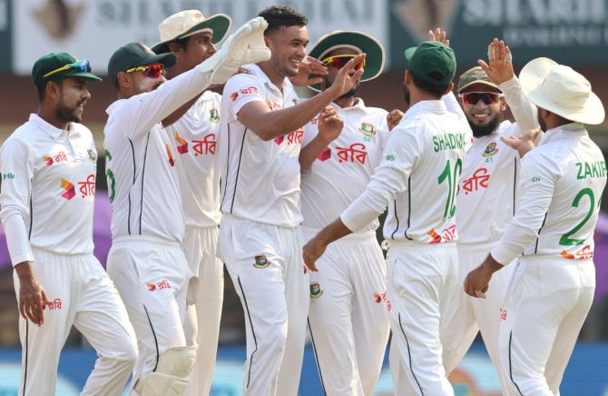 Bangladesh's players celebrate after Taskin Ahmed dismissed Rohit Sharma.