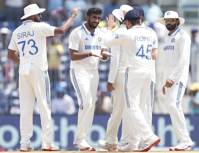 Jasprit Bumrah celebrates with teammates after taking the wicket of Shadman Islam.