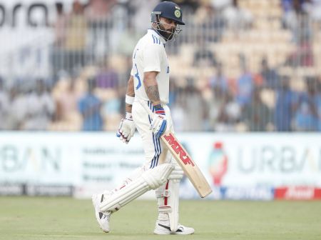 Virat Kohli walks back after his dismissal.