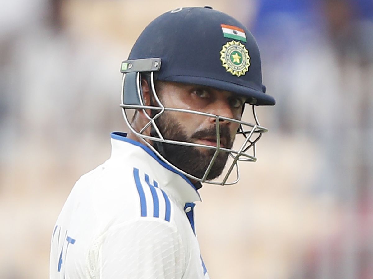 Virat Kohli walks back after his dismissal.