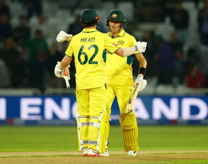 Travis Head and Marnus Labuschagne celebrate after completing a resounding victory for Australia.