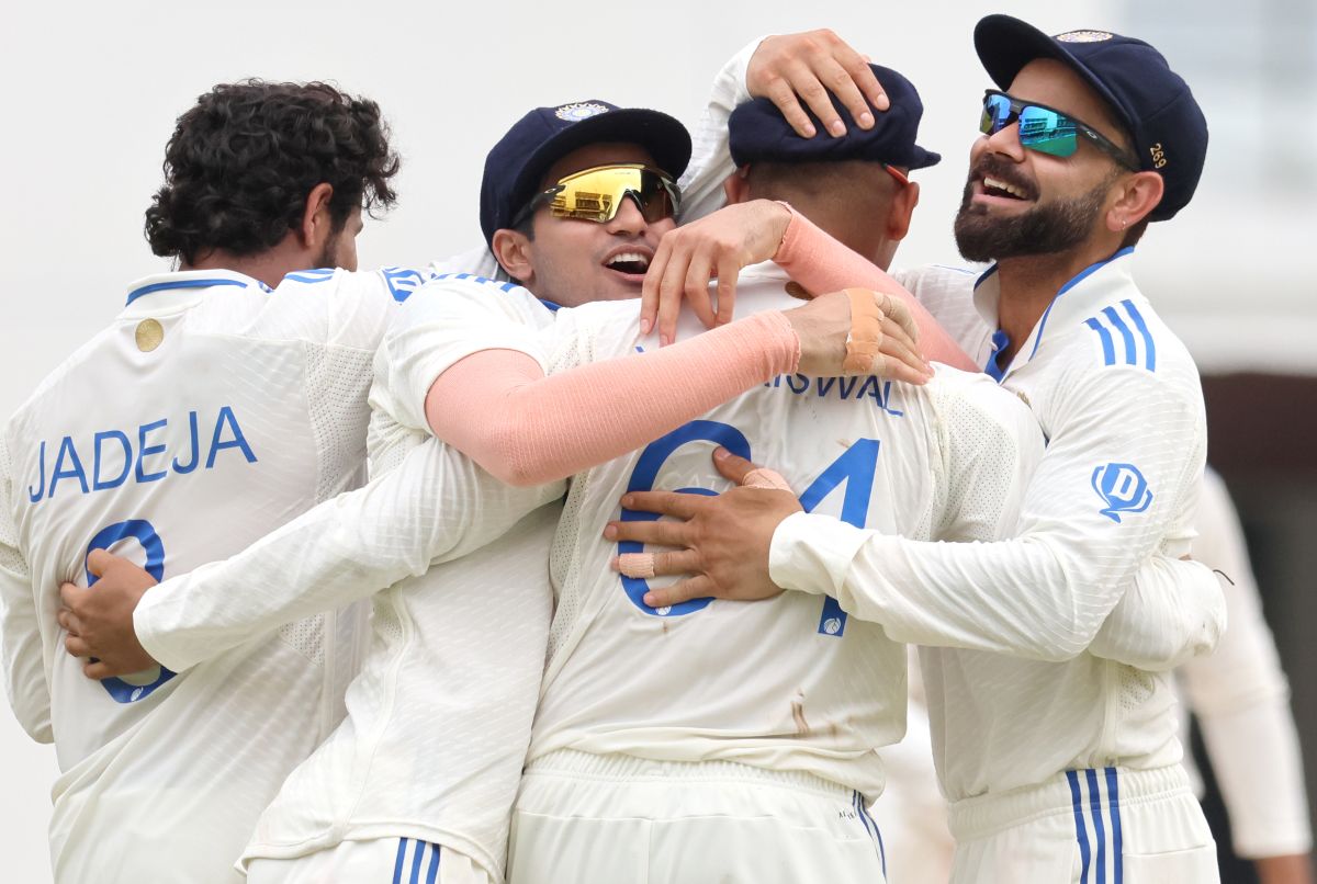 India's players celebrate with Yashasvi Jaiswal after he took the catch to dismiss Zakir Hasan off the bowling of Jasprit Bumrah