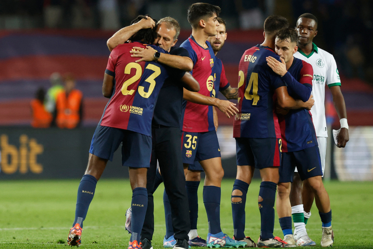 FC Barcelona coach Hansi Flick and Jules Kounde celebrate after the match against Getafe at Estadi Olimpic Lluis Companys, Barcelona, Spain, on Wednesday 