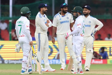 India and Bangladesh players wait before the umpires half play just after lunch 