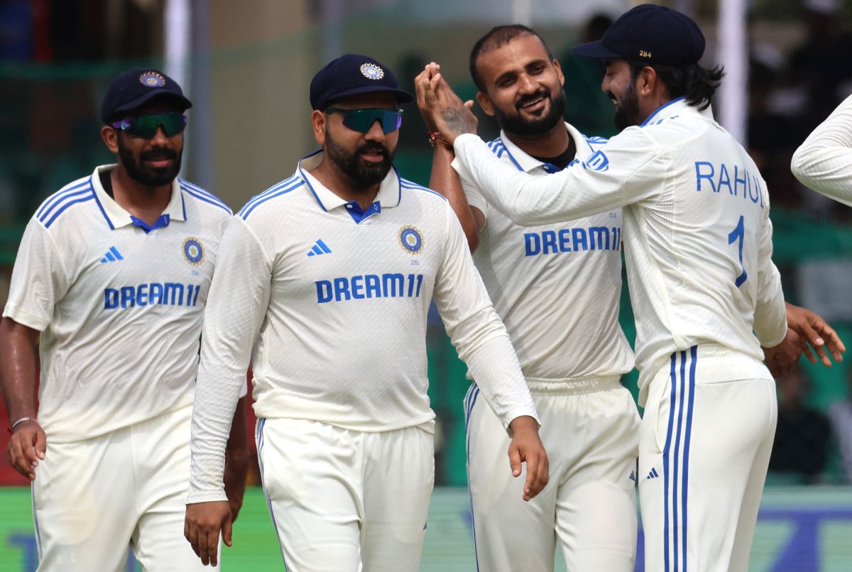 Akash Deep celebrates with teammates after the wicket of Zakir Hasan.