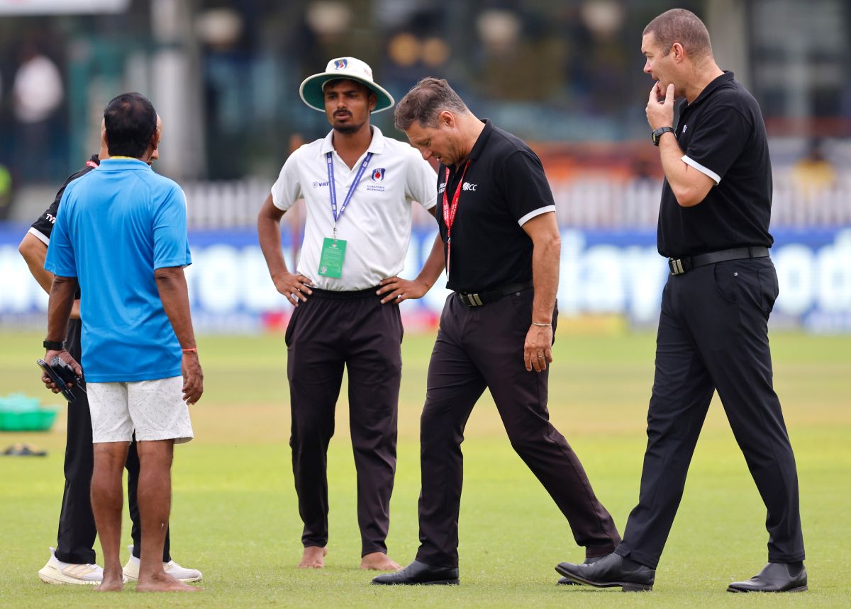 Umpires Richard Kettleborough and Chris Brown inspect the outfield.