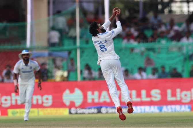 Ravindra Jadeja takes a catch off his own bowling to dismiss Syed Khaled Ahmed