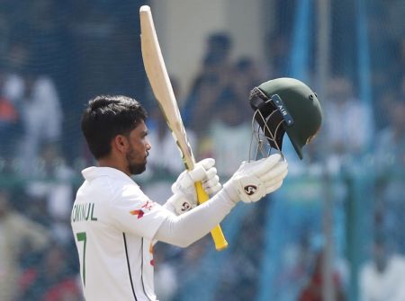 Mominul Haque celebrates his century.