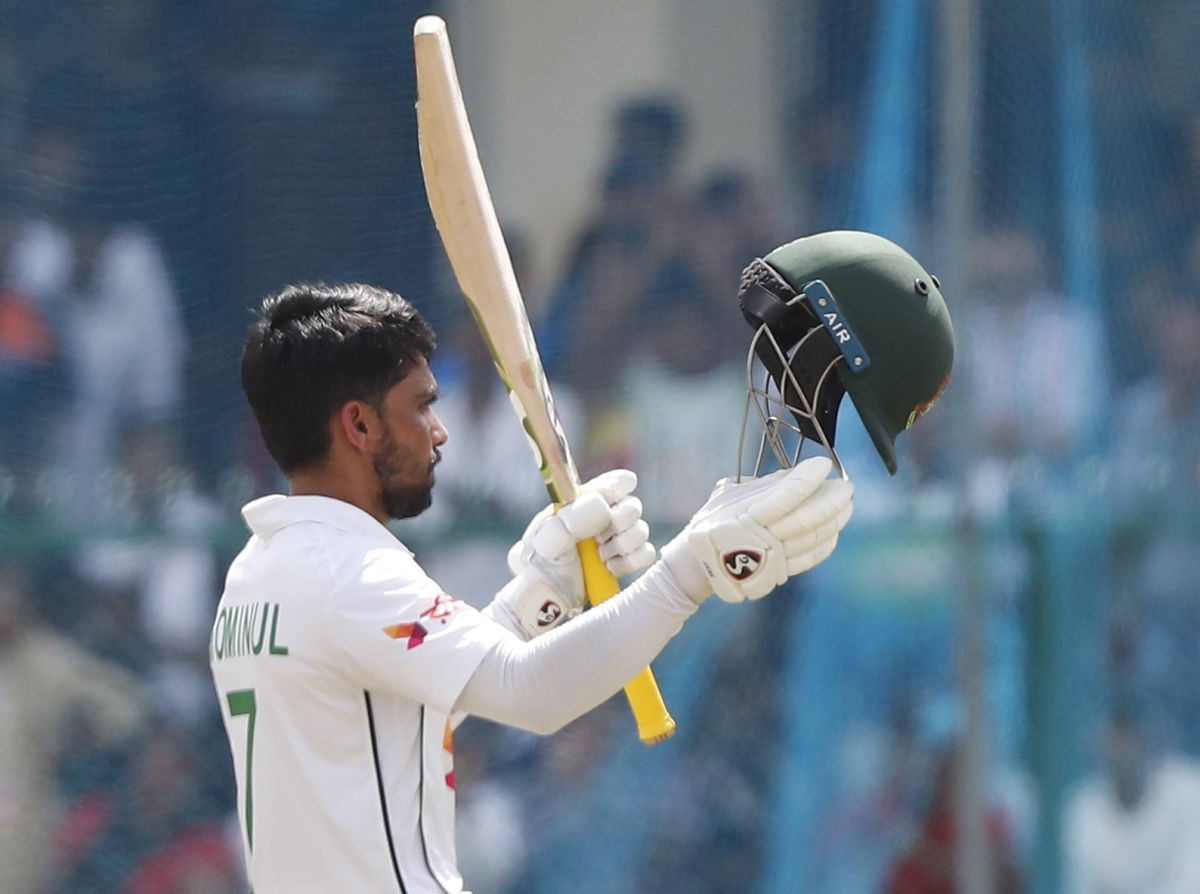 Mominul Haque celebrates his century.