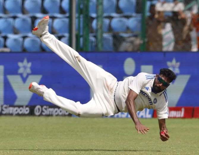 Mohammed Siraj takes the catch to dismiss Shakib Al Hasan off the bowling of Ravichandran Ashwin.