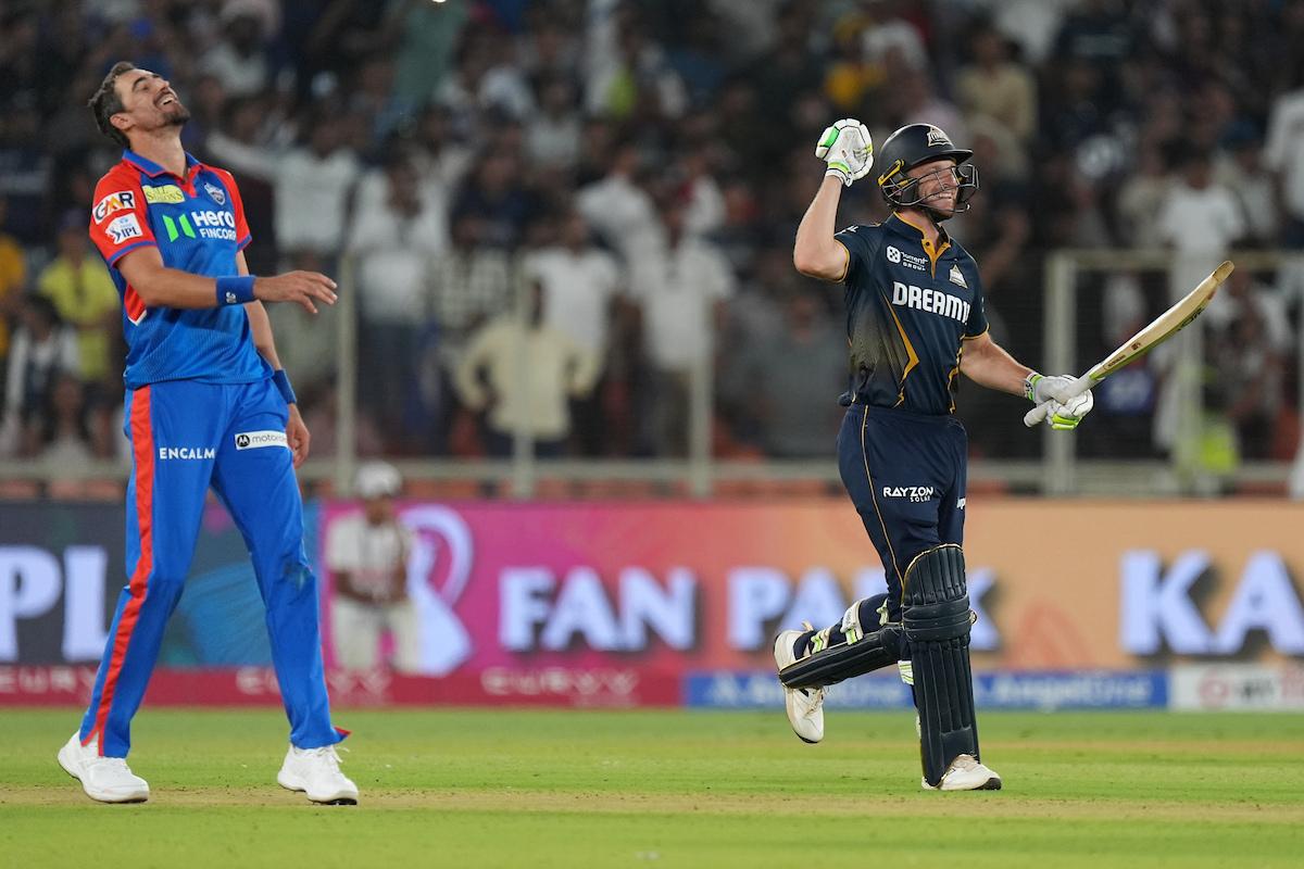 Jos Buttler celebrates Gujarat Titans' win over Delhi Capitals in Ahmedabad on Saturday