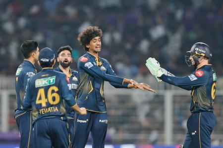 Gujrat Titans' Sai Kishore celebrates the wicket of Kolkata Knight Riders' Ajinkya Rahane
