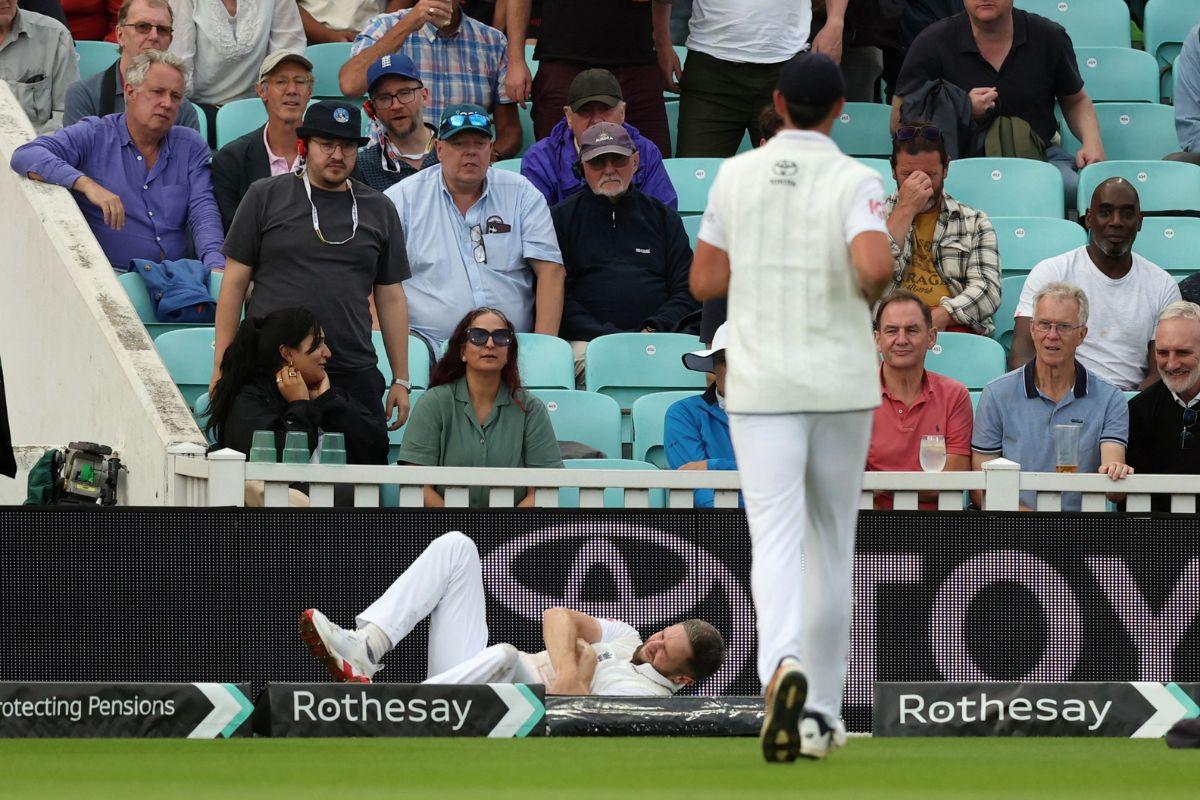 England's Chris Woakes grimaces in pain reacts after sustaining an injury while fielding on Day 1 of the 5th Test at The Oval on Thursday.