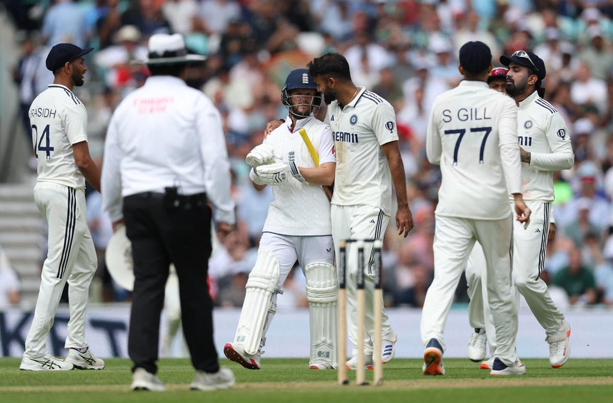 Akash Deep puts his arm around Ben Duckett after taking his wicket.
