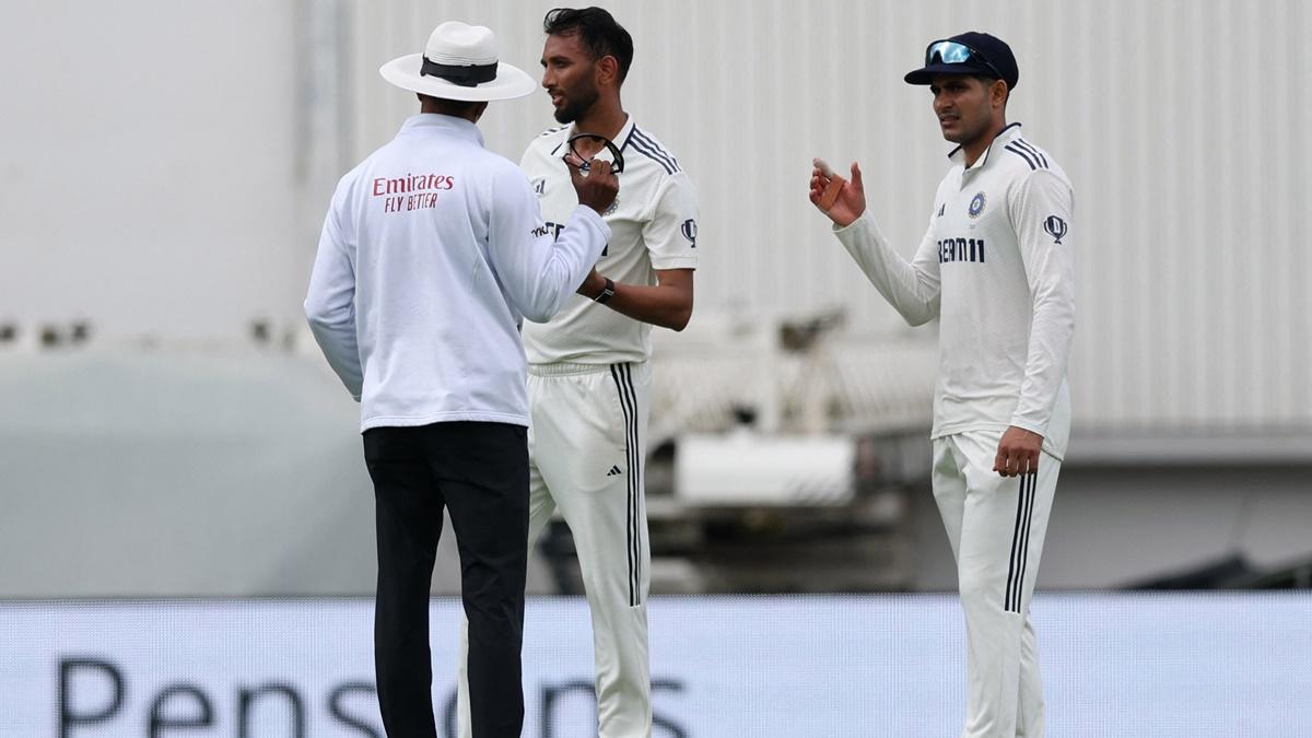 India's captain Shubman Gill watches as umpire Kumar Dharmasena steps in to calm things down after Prasidh Krishna and Joe Root exchange words during Day 2 of the fifth Test against England at Kia Oval, London, on Friday.