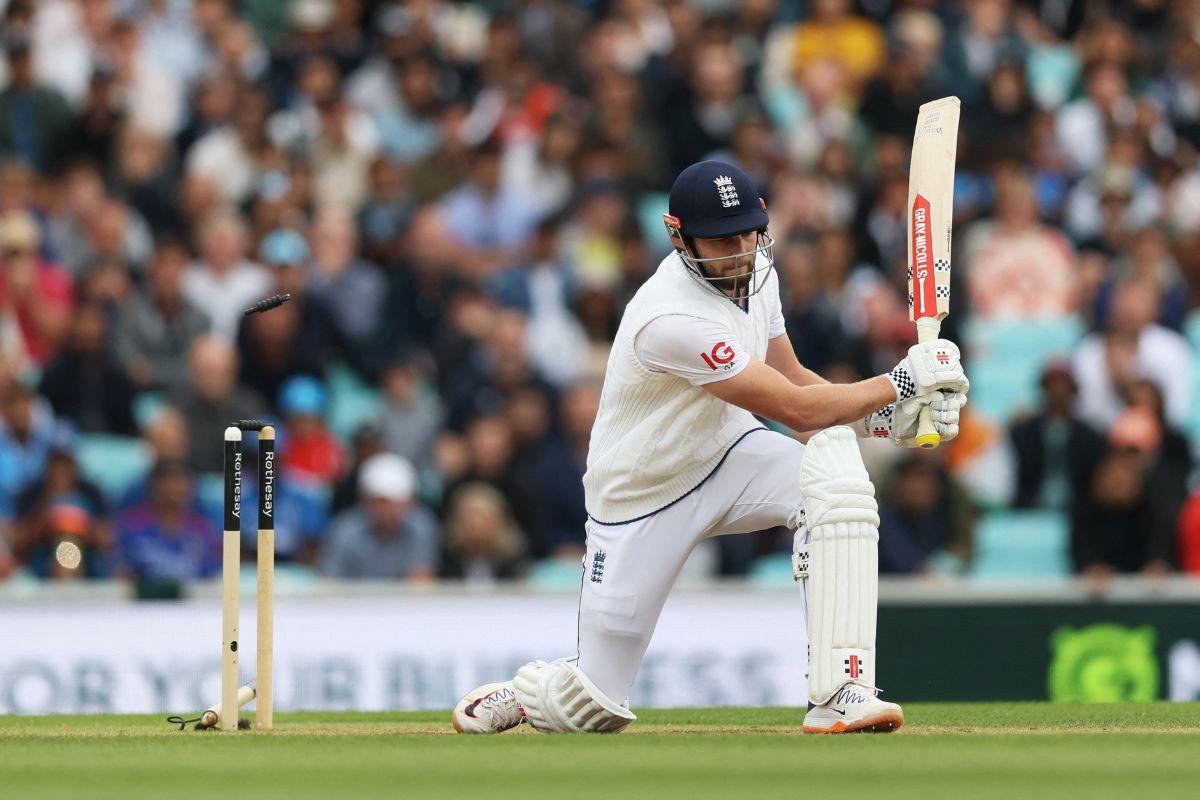 England's Gus Atkinson is bowled by India's Mohammed Siraj 