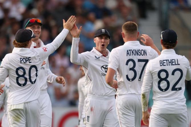 England's Harry Brook celebrates with Gus Atkinson and Ollie Pope and after taking the wicket of India's Dhruv Jurel. Brook was recently named England's white-ball captain