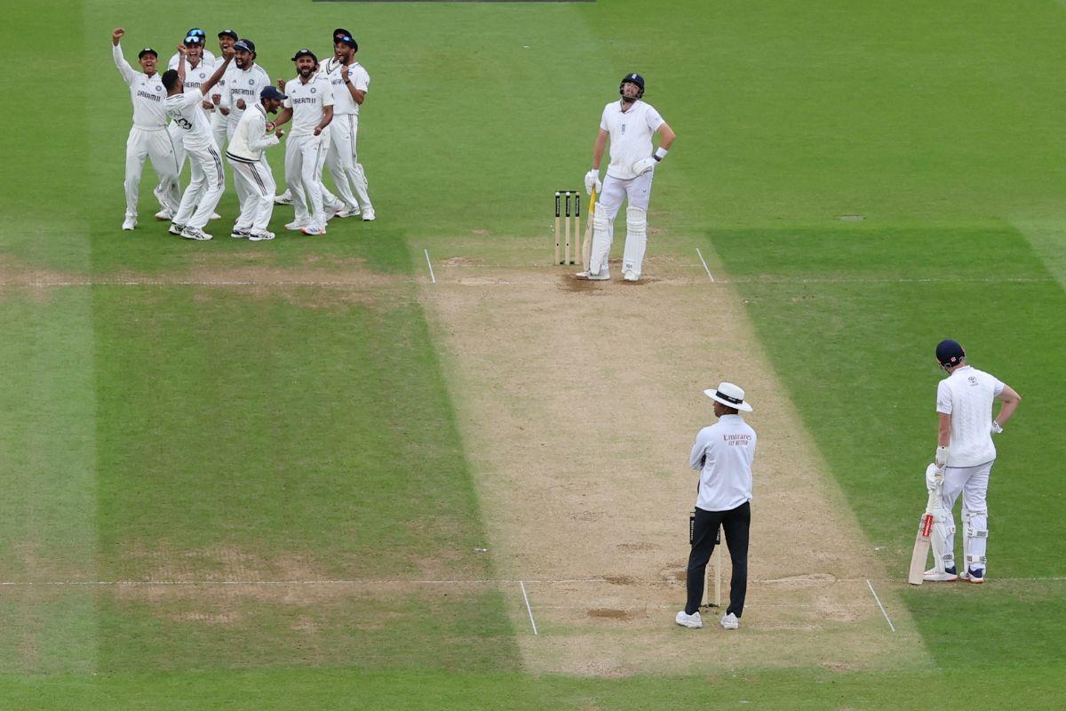 India's Mohammed Siraj celebrates with teammates after taking the wicket of England's Jamie Overton