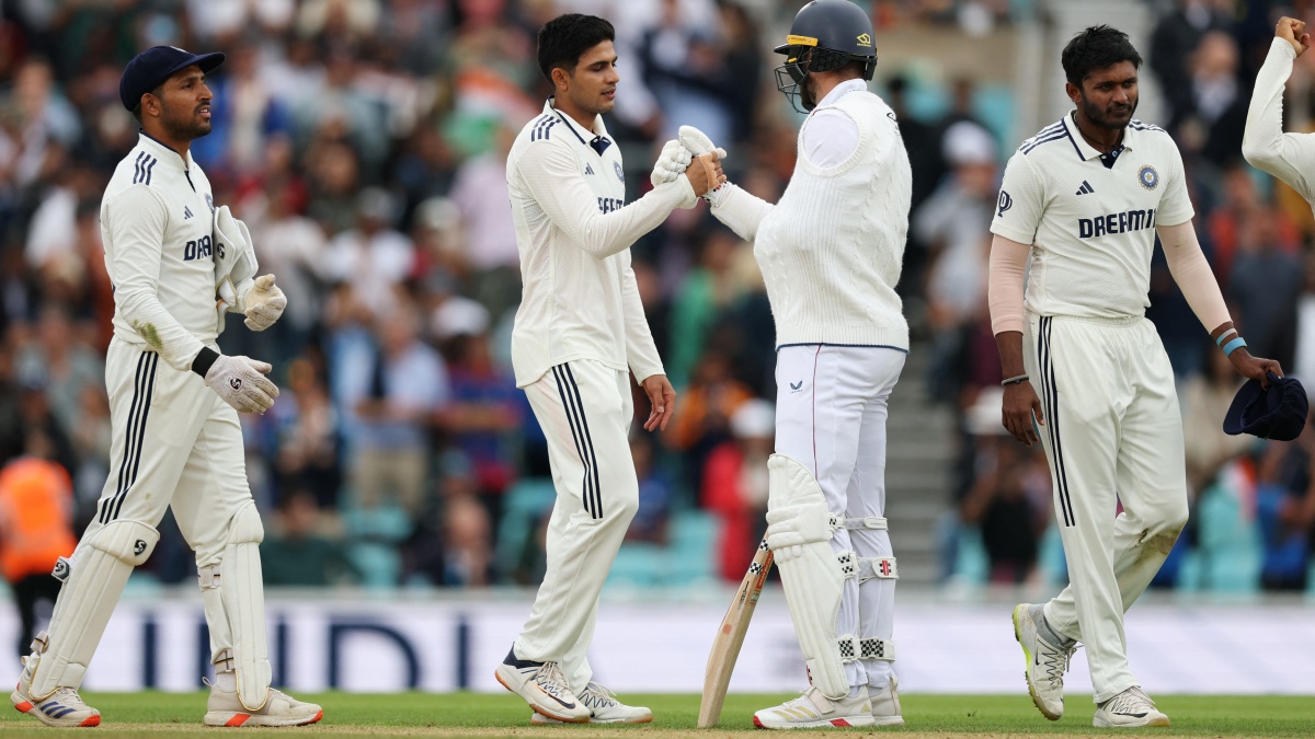 Shubman Gill shakes hands with Chris Woakes after the wicket of England's Gus Atkinson