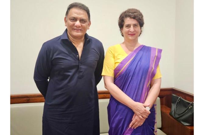 Congress leader Mohammad Azharuddin with Congress MP Priyanka Gandhi on Friday