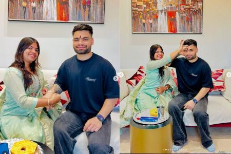 Neha Singh ties a rakhi on her brother Rinku Singh's wrists and performs a ritual