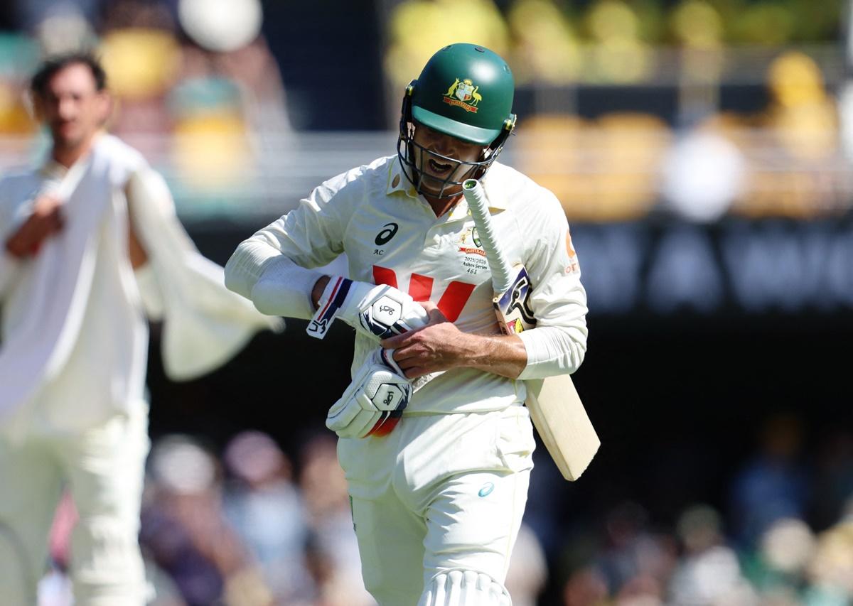 Alex Carey walks back to the pavilion after being caught by England's Jamie Smith off the bowling of Gus Atkinson. 