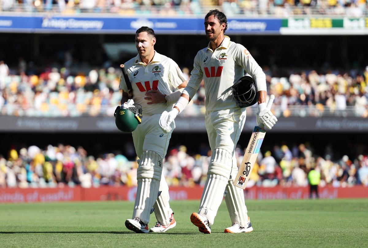 Australia's Mitchell Starc and Scott Boland walk back to the pavilion at the tea break on Day 3 of the second Ashes Test at The Gabba, Brisbane, on Saturday.