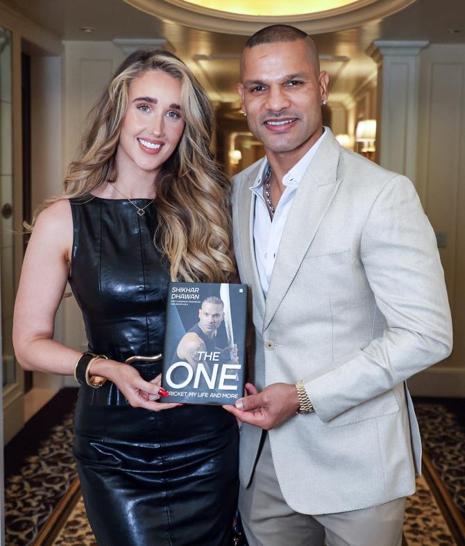 Former India opener Shikhar Dhawan and his girlfriend Sophie Shine at the launch of his autobiography 'The One: Cricket, My Life and More', in New Delhi on Sunday.