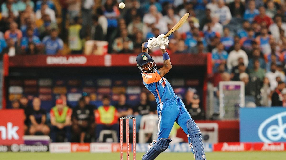 Hardik Pandya hits a boundary during the fourth T20I against England in Pune on Friday