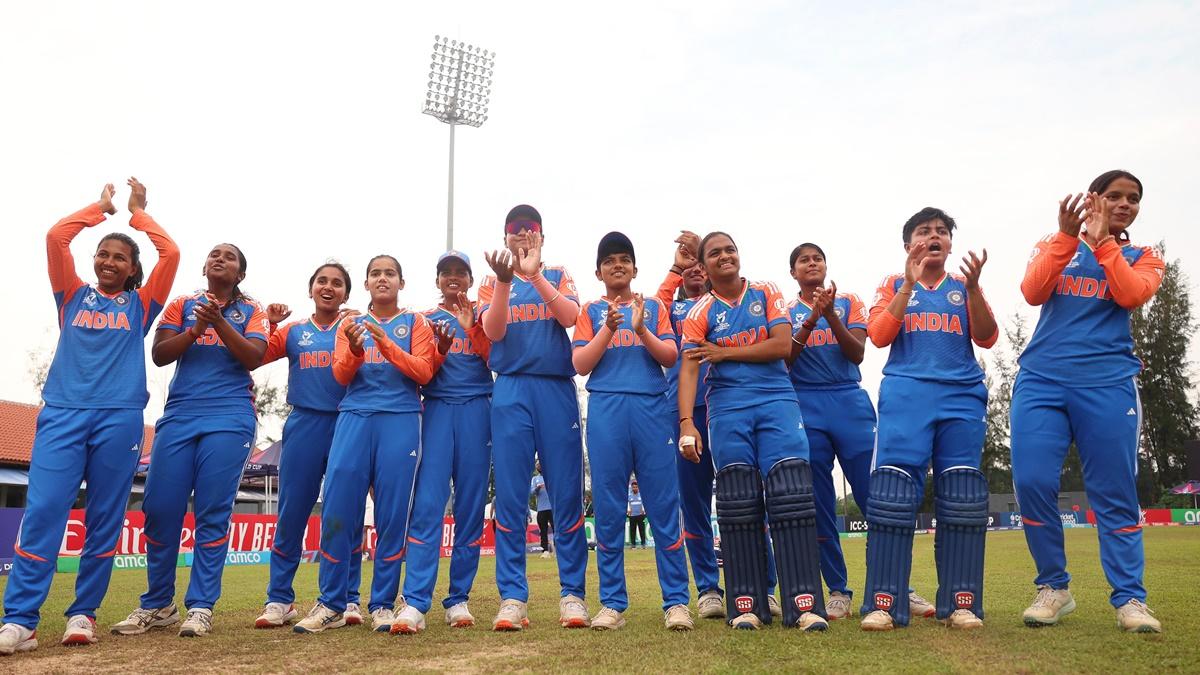 India's players celebrate victory over England in the semi-final of the women's Under-19 T20 World Cup.