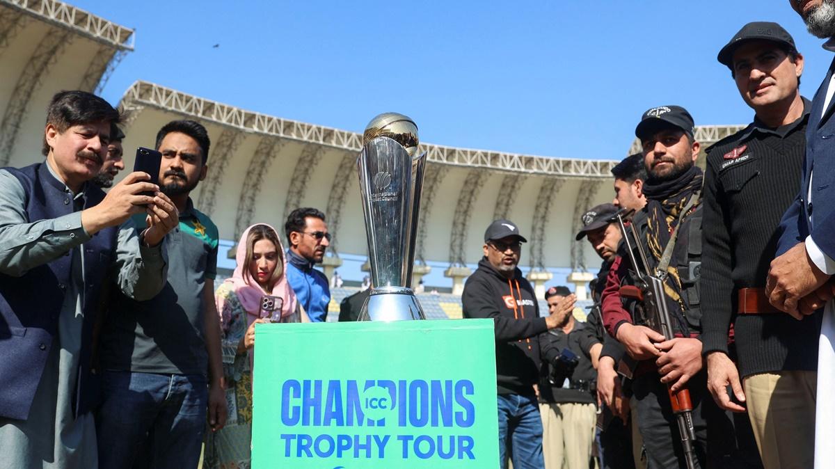 People take photos of the ICC Champions Trophy during the final stop of its tour at the Arbab Niaz Cricket Stadium in Peshawar, Pakistan.