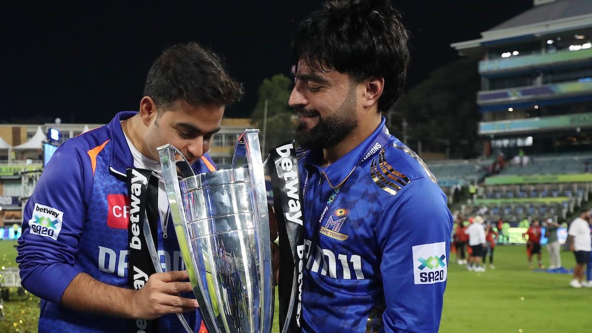 Akash Ambani, owner of MI Cape Town, and skipper Rashid Khan with trophy.