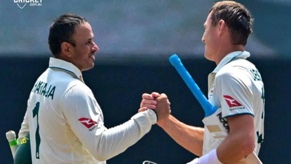 Usman Khawaja and Marnus Labuschagne celebrate victory over Sri Lanka in the second Test at Galle on Sunday.